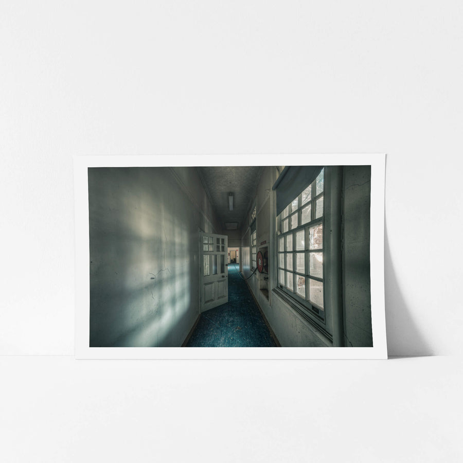 Long Blue Walk at The Asylum, a narrow corridor stretches deep into the building.