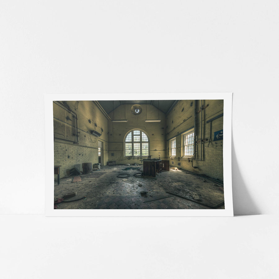 Mechanical Workshop at The Asylum, a high-ceilinged hall with a corrugated iron roof pitched to a central ridge.