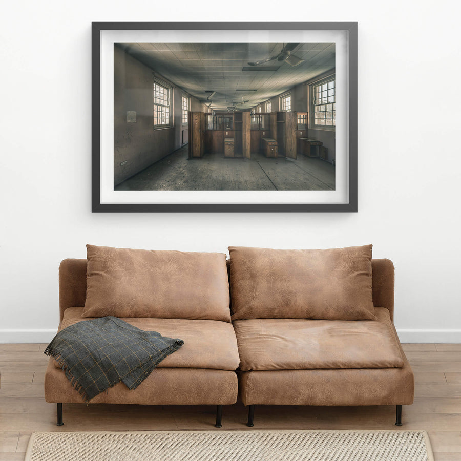 Patient Partitions at The Asylum, timber partitions stand clustered in the centre of a long ward.