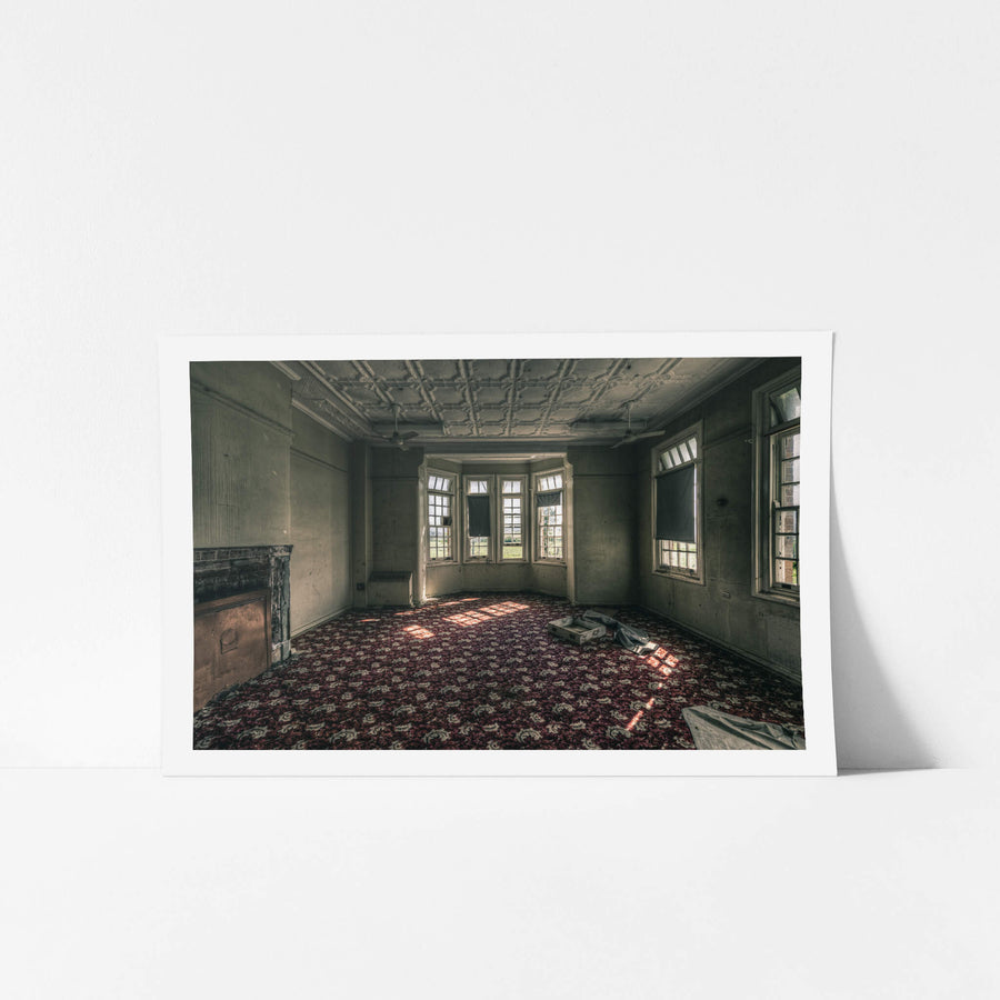 The Grand Room at The Asylum, a deep crimson and grey floral carpet covers the entire floor, still intact.