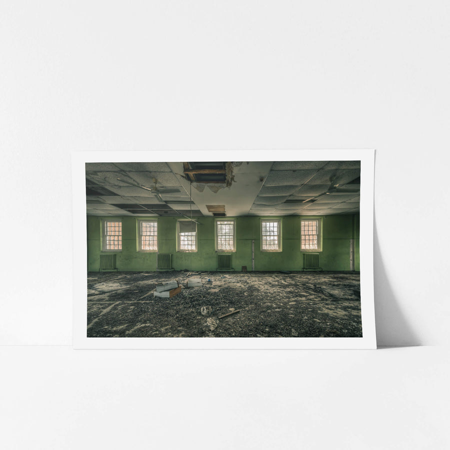 Windows to the World at The Asylum, six windows line a pale green wall, each fitted with heavy security grilles.