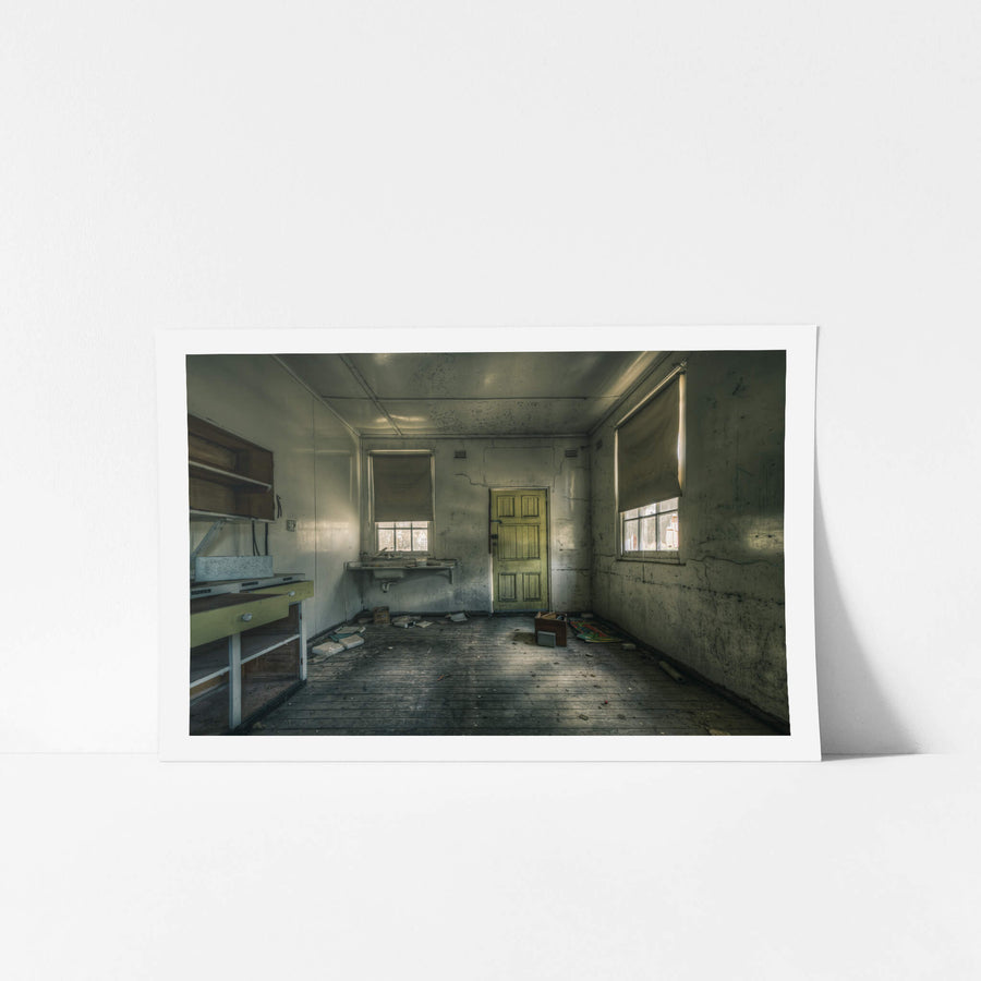 Workbench at The Asylum, a green six-panel door sits closed against a cracked plaster wall.