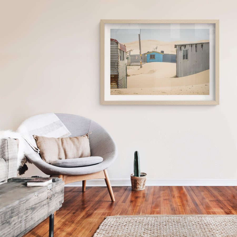City Centre at Tin City, sand drifts between corrugated iron shacks, banking against walls in smooth curves.