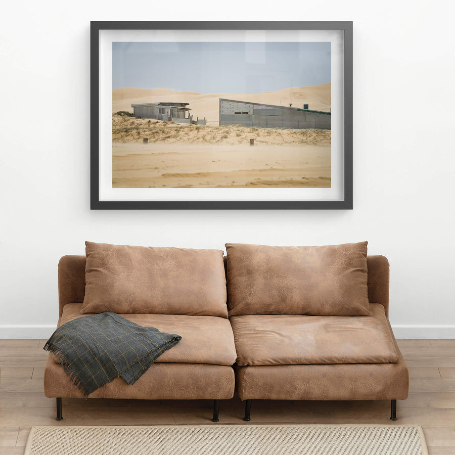 From The Beach at Tin City, two corrugated iron structures sit low against the dunes at Tin City, Stockton Beach.