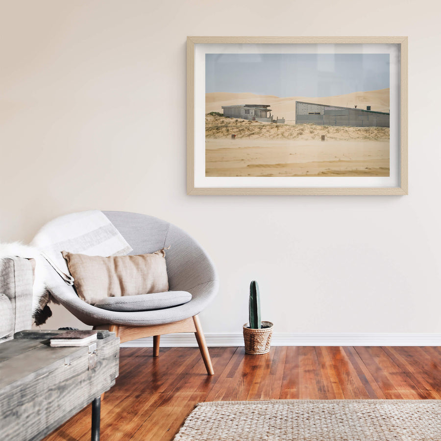 From The Beach at Tin City, two corrugated iron structures sit low against the dunes at Tin City, Stockton Beach.
