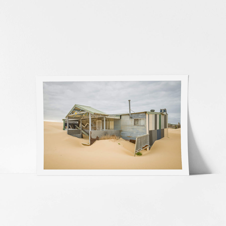 Front Yard at Tin City, the sand swept porch of one of the Tin City shacks.