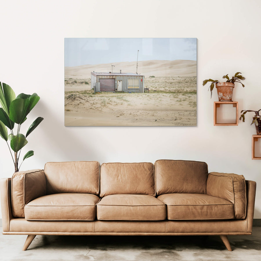 Seven Seven South West at Tin City, shack number seven sits alone against a wall of sand dunes that rises behind it like.