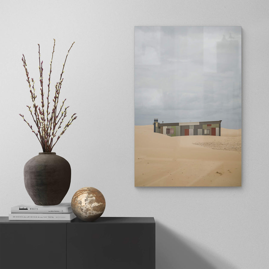 Waves at Tin City, a corrugated iron shack sits half-swallowed by sand dunes at Tin City.