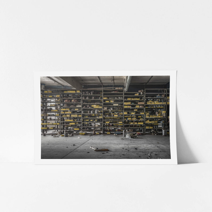 A Mechanical Store at Wangi Power Station, steel shelving runs floor to ceiling across the back wall of the mechanical store.