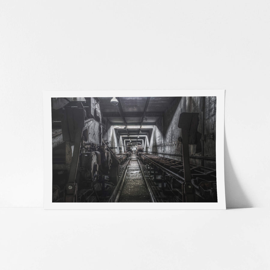 Bunker Conveyors at Wangi Power Station, a narrow corridor stretches deep between steel bunker walls.