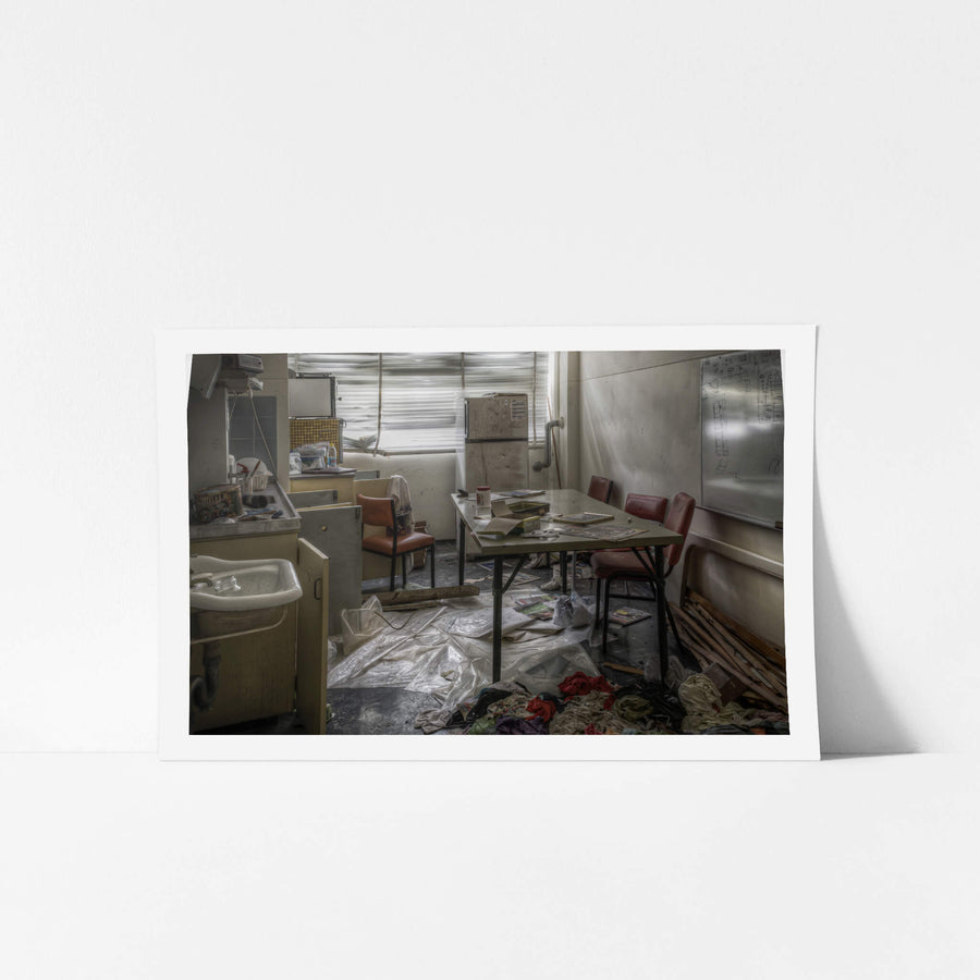 First Aid Centre Kitchen at Wangi Power Station, a steel-legged table sits centre of the room, surrounded by vinyl chairs.