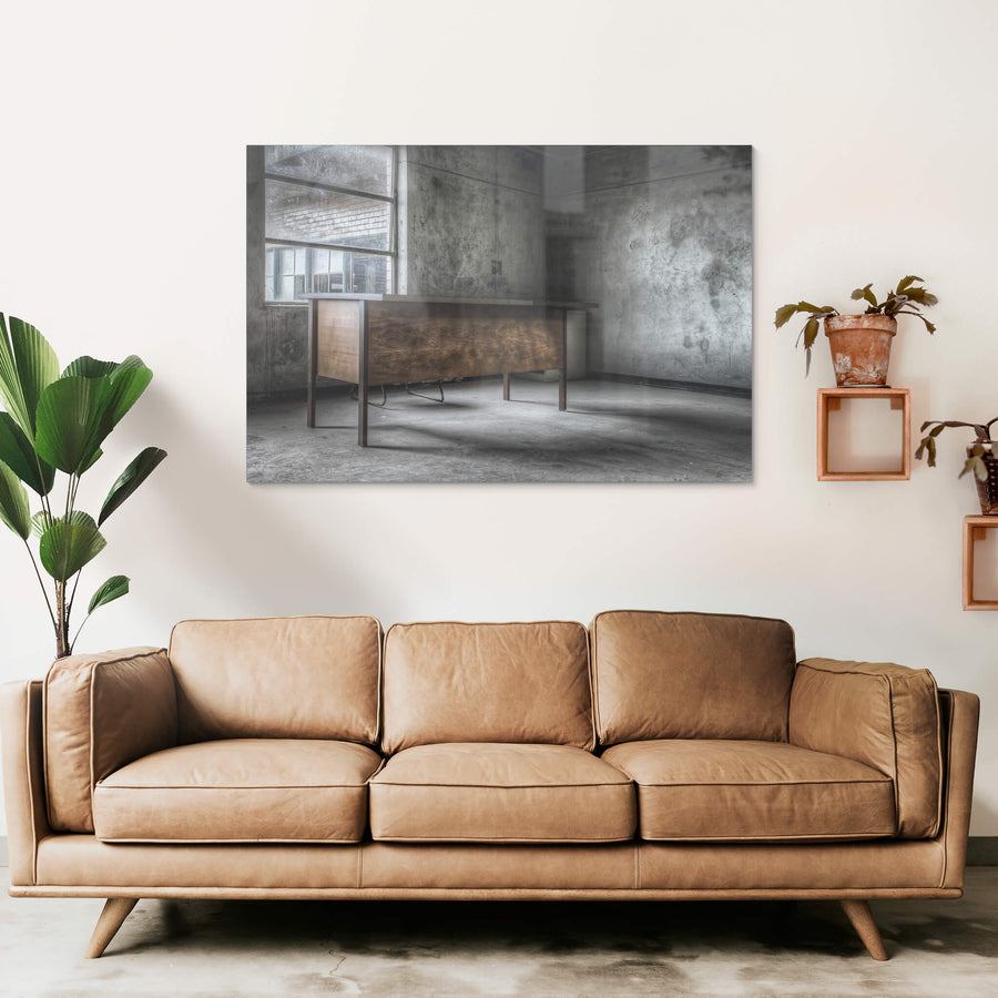 Office Desk at Wangi Power Station, a timber veneer desk sits alone in a concrete room.