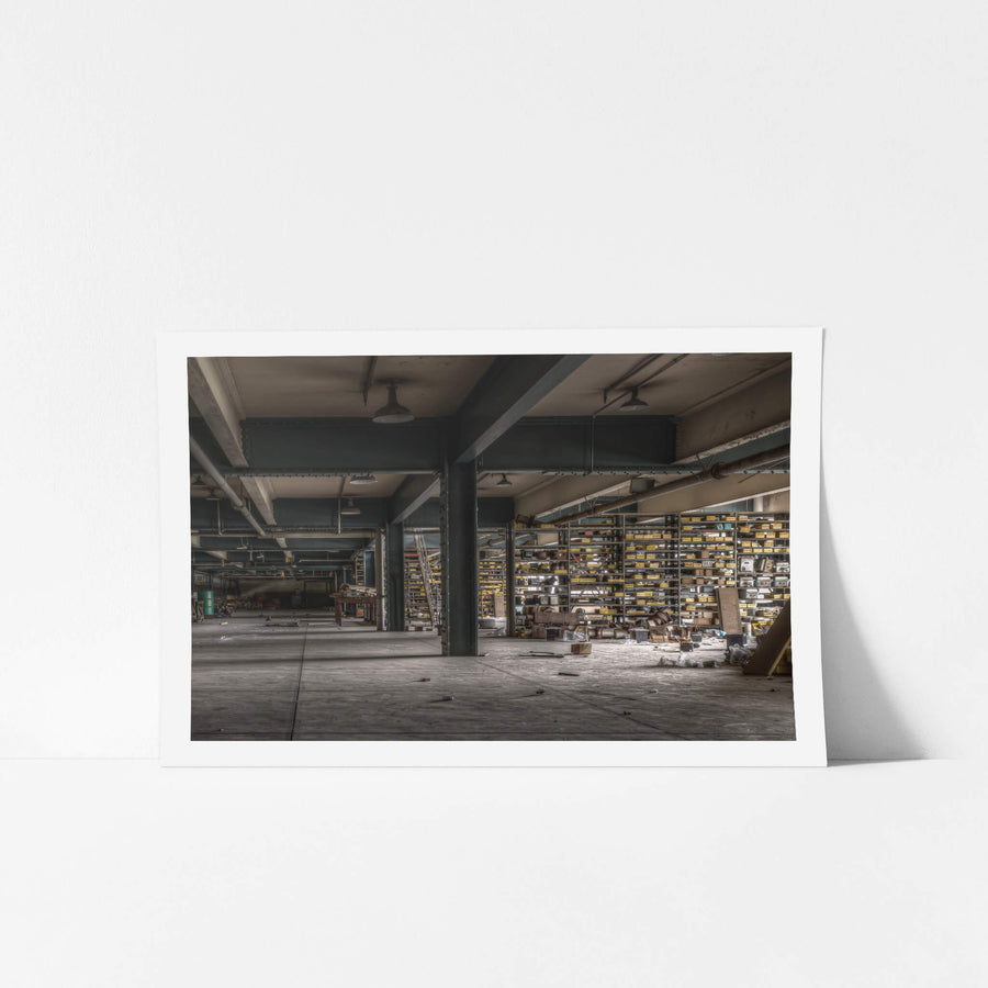 Store Roof 2 at Wangi Power Station, steel columns painted dark teal carry heavy I-beams across a low ceiling.