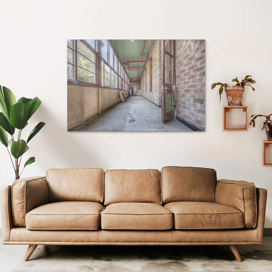 Annex at Waterfall Sanatorium, a long enclosed corridor runs between a brick ward building and a wall of timber-framed.