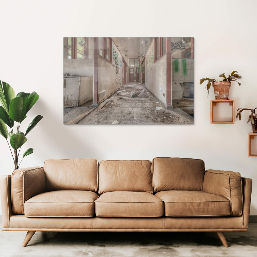 Fallen Through at Waterfall Sanatorium, a corridor runs between partitioned rooms, their maroon-trimmed frames holding.