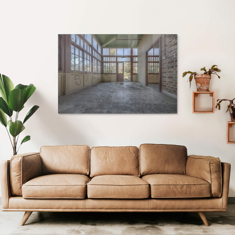 Glasshouse at Waterfall Sanatorium, frosted glass panels fill the walls from dado rail to ceiling, framed in dark timber.