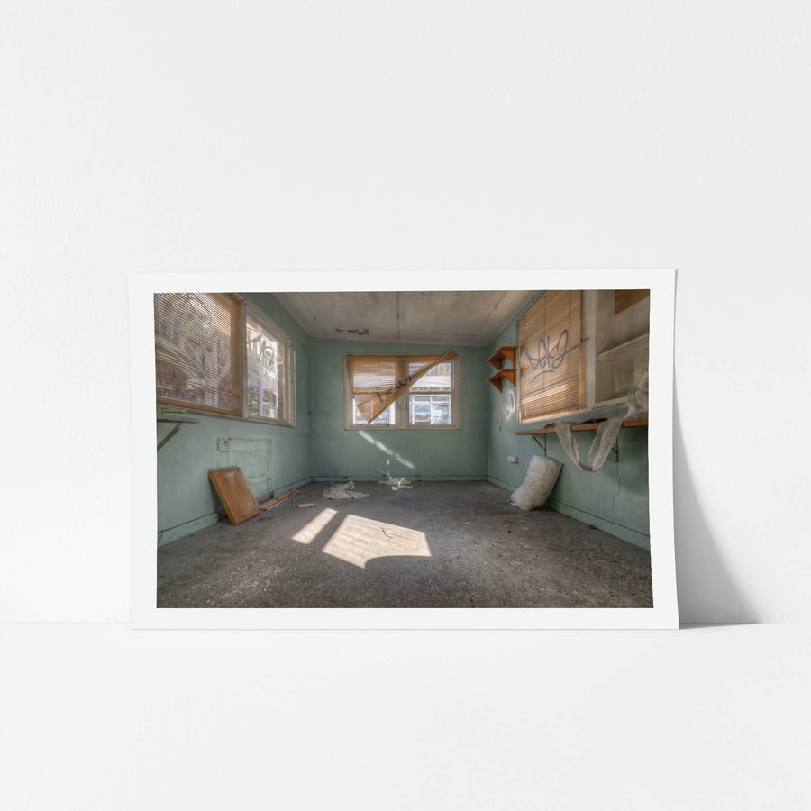 Peeking Through The Blinds at Waterfall Sanatorium, pale green walls hold three windows.