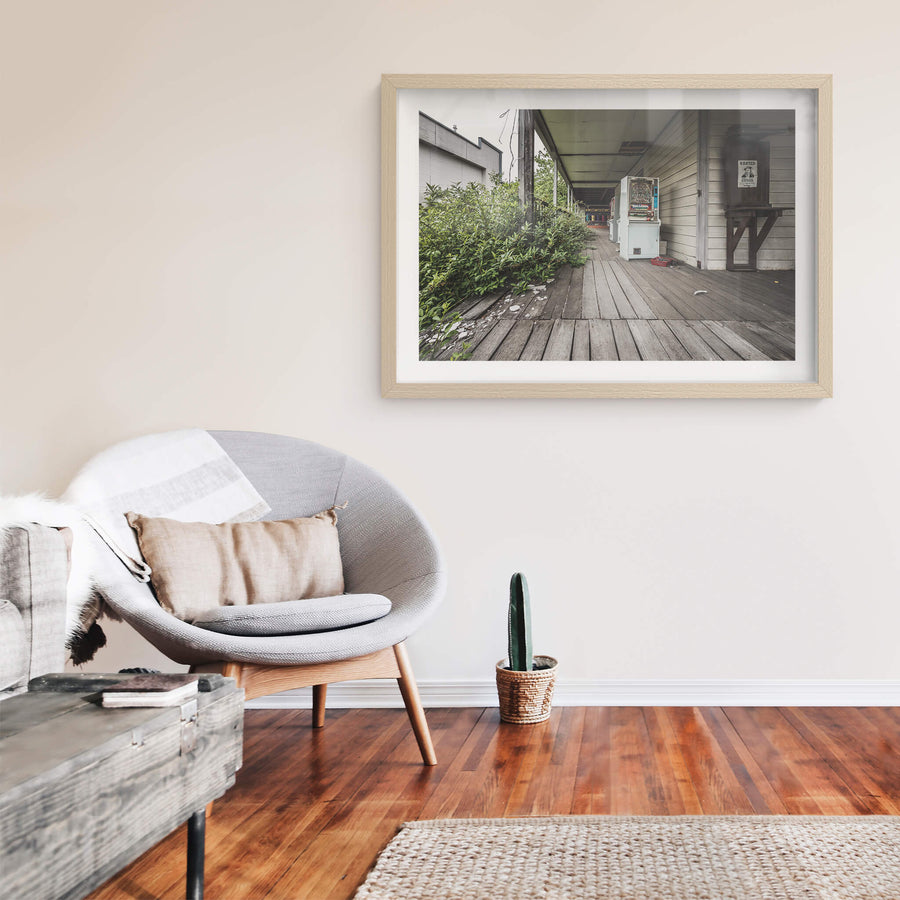 Verandah at Western Village, a weathered timber verandah runs along a western-style clapboard building.