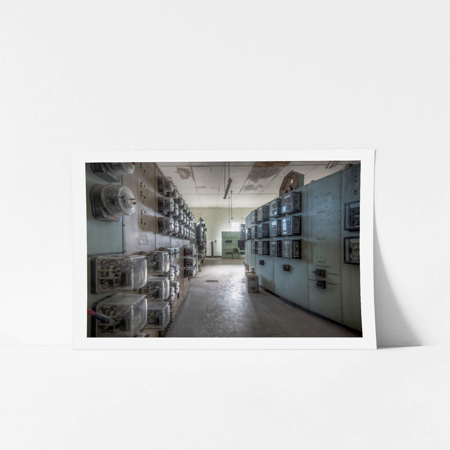 Ammeter Wall at White Bay Power Station, rows of glass-cased ammeters and relay instruments line both walls of a narrow.