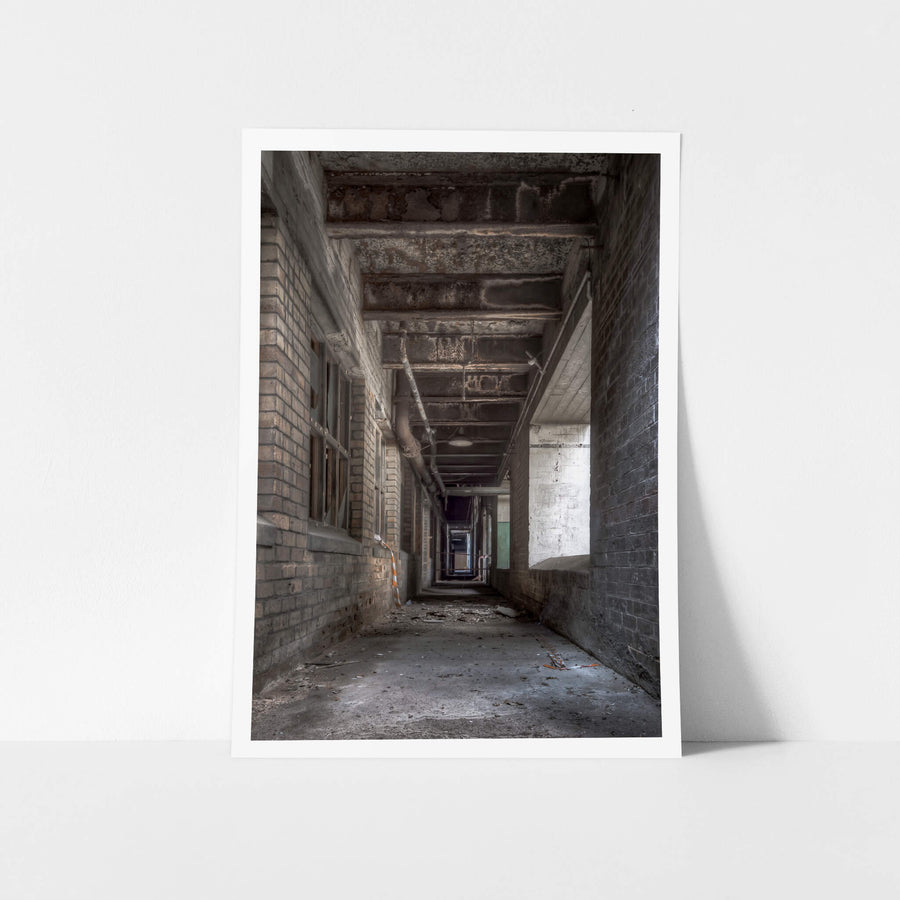 Beneath Pump House at White Bay Power Station, a brick-lined corridor runs beneath the Pump House, narrowing into darkness.