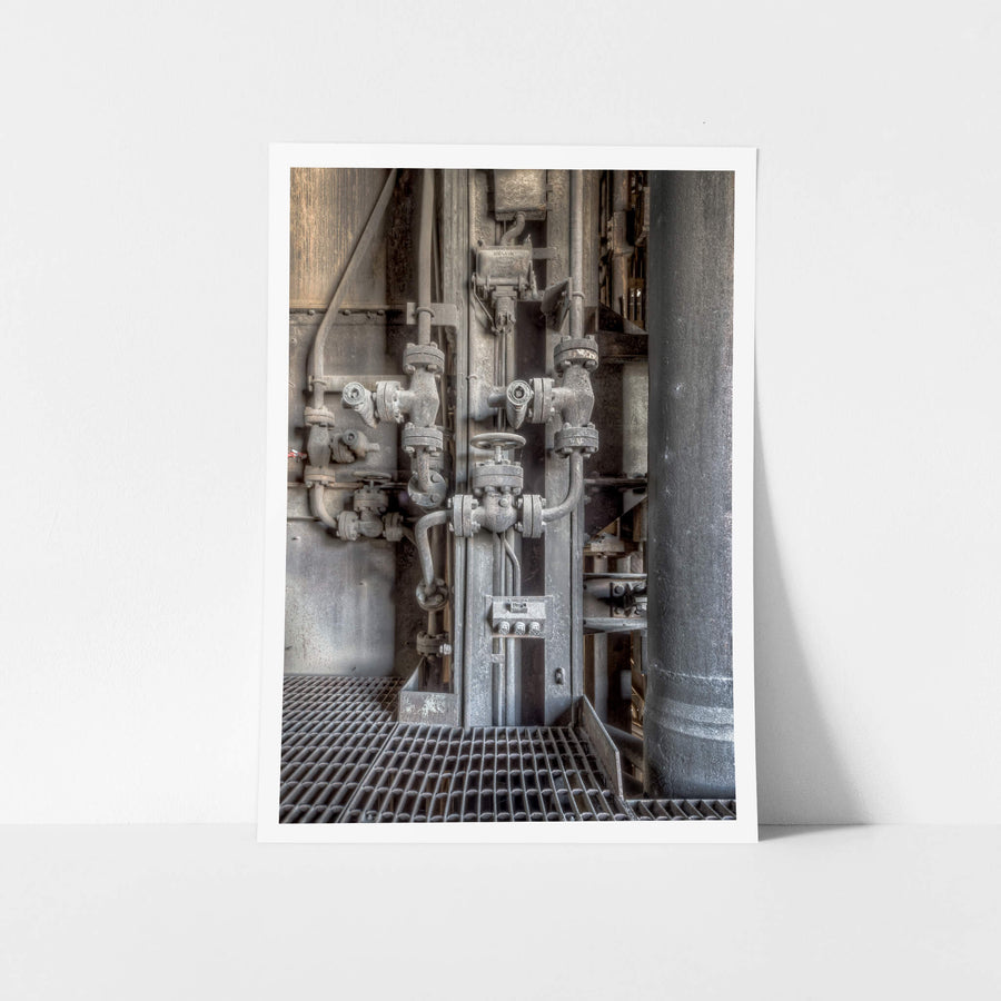 Boiler Valves at White Bay Power Station, a cluster of cast-iron gate valves and stop valves sits bolted to a vertical.
