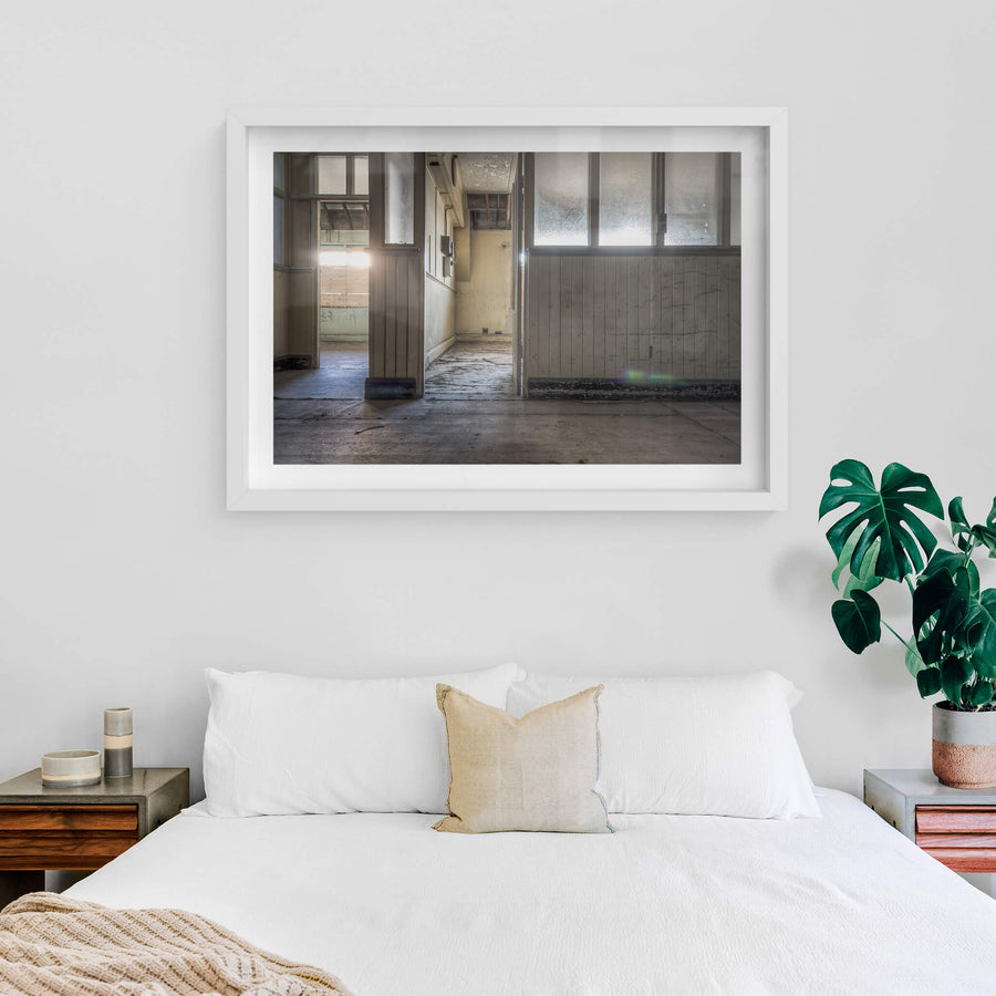 Offices at White Bay Power Station, frosted glass panels line the partition wall, their surface clouded with grime.