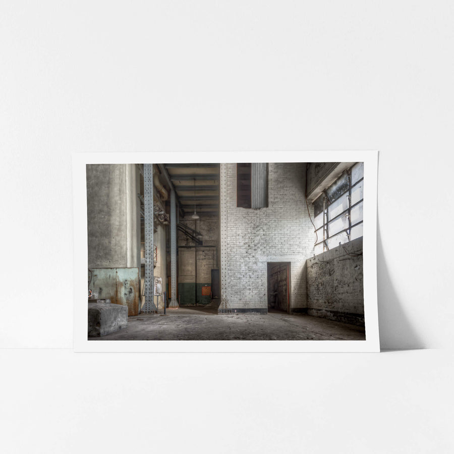Turbine Hall Basement North End at White Bay Power Station, white-painted brick rises two storeys to meet riveted steel.