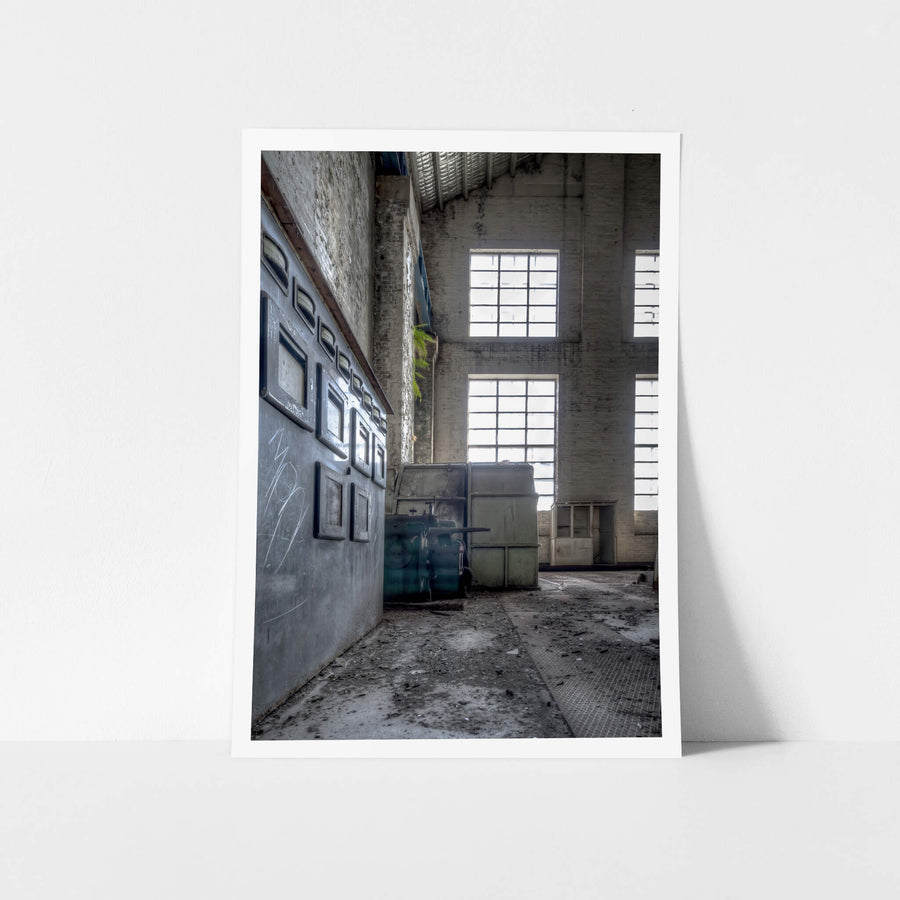 Turbine Hall Windows at White Bay Power Station, a steel indicator panel lines the left wall, its gauge windows dark.