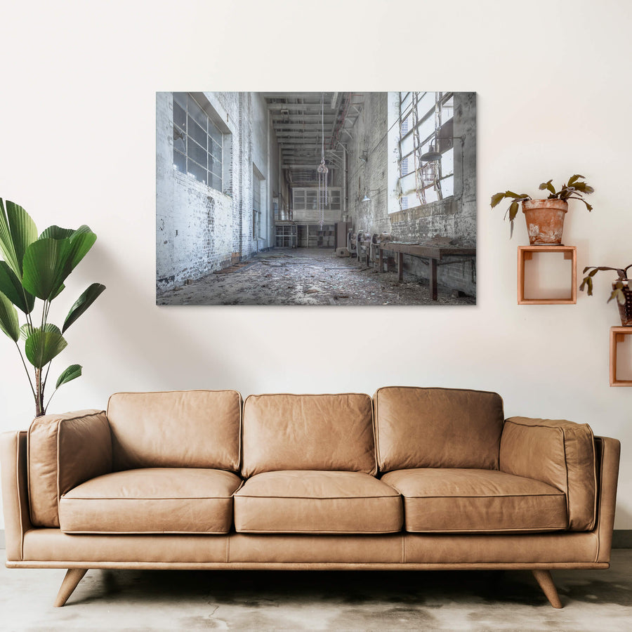 Workshop at White Bay Power Station, a chain block hangs from the ceiling on heavy links, motionless above a floor thick.