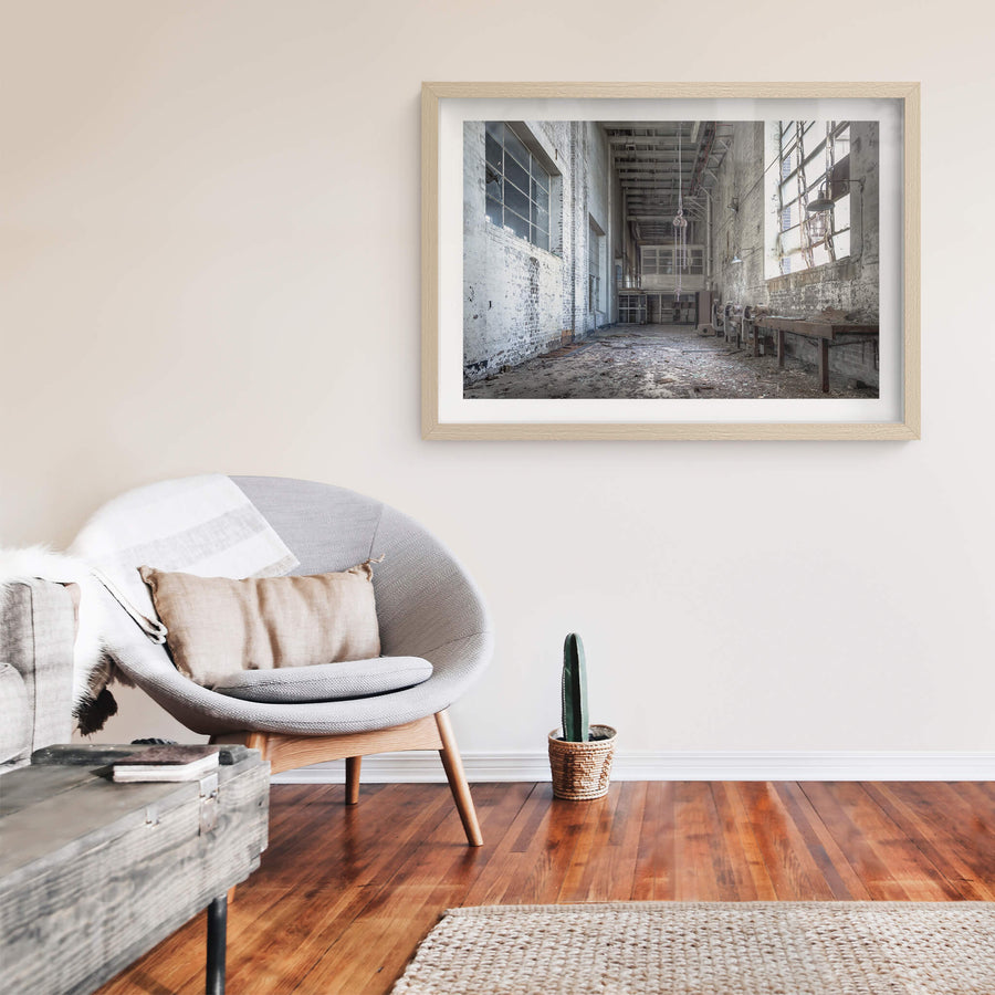 Workshop at White Bay Power Station, a chain block hangs from the ceiling on heavy links, motionless above a floor thick.